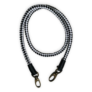 black and white with black tip hand-braided leather strap